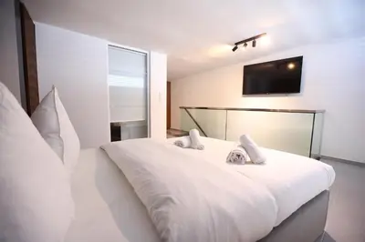 Ein Bett oder Betten in einem Zimmer der Unterkunft JAM Apartments