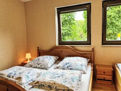 Ein Bett oder Betten in einem Zimmer der Unterkunft Apartment Ferienapartments Adenau-2 by Interhome