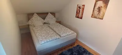 Ein Bett oder Betten in einem Zimmer der Unterkunft Ferienwohnung Elisabeth Waxweiler