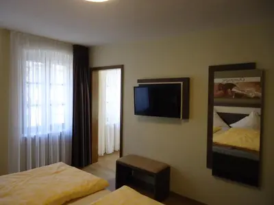 Ein Bett oder Betten in einem Zimmer der Unterkunft Gasthaus Huwer