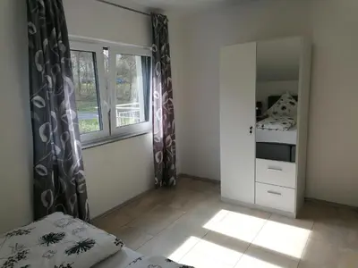 Ein Bett oder Betten in einem Zimmer der Unterkunft Haus Kleeblatt