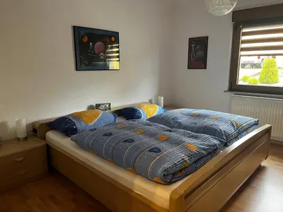 Ein Bett oder Betten in einem Zimmer der Unterkunft Ferienwohnung Schneider