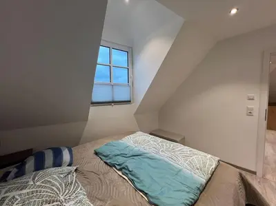 Ein Bett oder Betten in einem Zimmer der Unterkunft Zentrale große Wohnung in Prüm für erholsamen Urlaub