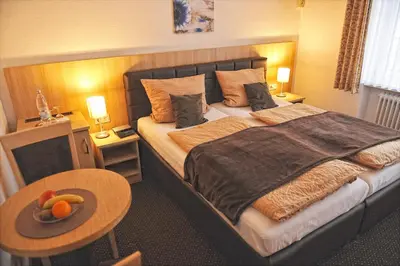 Ein Bett oder Betten in einem Zimmer der Unterkunft Wein & Gästehaus Rosenlay