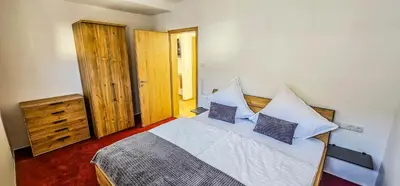 Ein Bett oder Betten in einem Zimmer der Unterkunft Ferienwohnung - Riesling Ambiente - im Weingut Andries