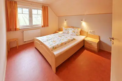 Ein Bett oder Betten in einem Zimmer der Unterkunft Ferienweingut Ulrich Göbel