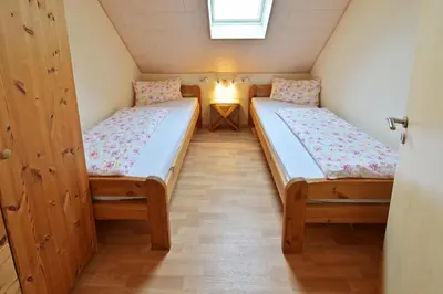 Ein Bett oder Betten in einem Zimmer der Unterkunft Ferienweingut Ulrich Göbel