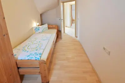 Ein Bett oder Betten in einem Zimmer der Unterkunft Ferienweingut Ulrich Göbel