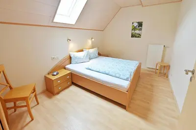 Ein Bett oder Betten in einem Zimmer der Unterkunft Ferienweingut Ulrich Göbel