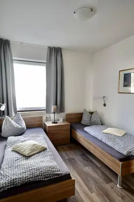Ein Bett oder Betten in einem Zimmer der Unterkunft Apartments Haus Daniela