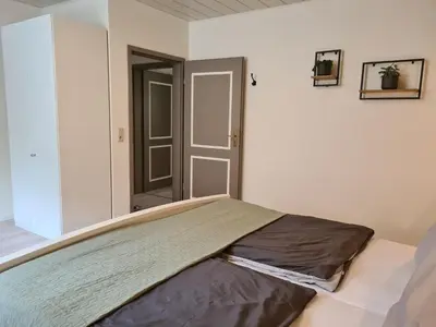Ein Bett oder Betten in einem Zimmer der Unterkunft FeWo Alt Beilstein