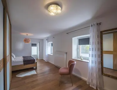 Ein Bett oder Betten in einem Zimmer der Unterkunft Das Schmitz Haus