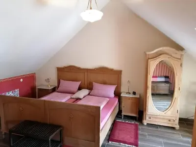 Ein Bett oder Betten in einem Zimmer der Unterkunft Ferienwohnungen Bistro Tebecks