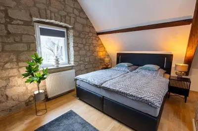 Ein Bett oder Betten in einem Zimmer der Unterkunft Lava-Lodge (Ferienhaus)