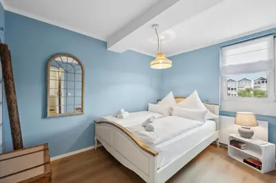 Ein Bett oder Betten in einem Zimmer der Unterkunft Apart You I Altstadt Apartment am Wasser mit Garten