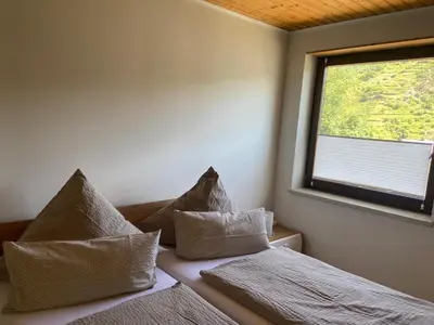 Ein Bett oder Betten in einem Zimmer der Unterkunft Haus Erika/ Fam. Frevel