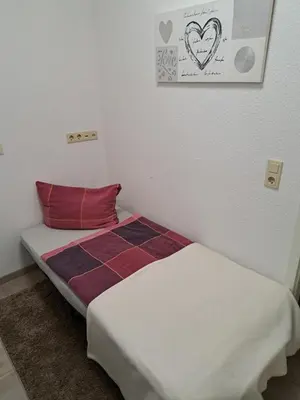 Ein Bett oder Betten in einem Zimmer der Unterkunft NEU! Fewo zum alten Bäckerlädchen