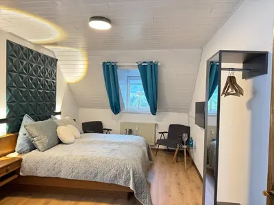 Ein Bett oder Betten in einem Zimmer der Unterkunft historisches Winzerhaus mit Moselblick