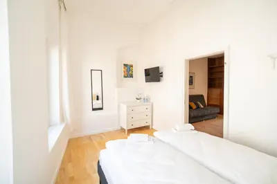Ein Bett oder Betten in einem Zimmer der Unterkunft Stadtoase nähe Uni mit Sauna