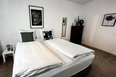 Ein Bett oder Betten in einem Zimmer der Unterkunft Stadtoase nähe Uni mit Sauna