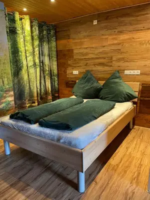 Ein Bett oder Betten in einem Zimmer der Unterkunft Farben Haus