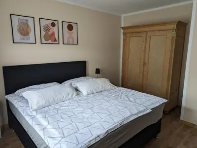 Ein Bett oder Betten in einem Zimmer der Unterkunft Haus Burgfee, EG