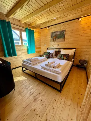 Ein Bett oder Betten in einem Zimmer der Unterkunft Chalet Lasserg