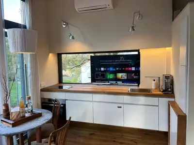 Küche/Küchenzeile in der Unterkunft Tinyhouse Minimalus III mit Whirlpool im Grünen