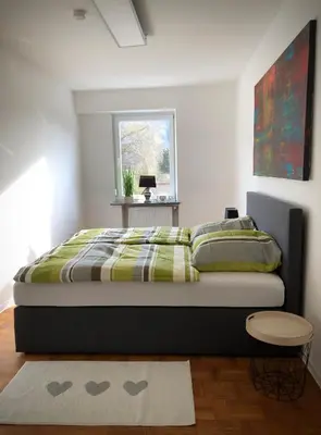Ein Bett oder Betten in einem Zimmer der Unterkunft Schneiders Ferienwohnungen