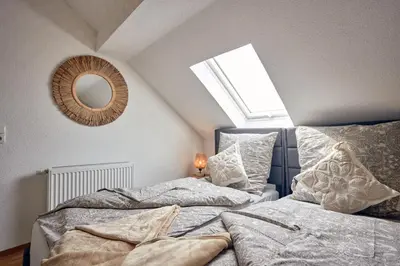 Ein Bett oder Betten in einem Zimmer der Unterkunft LIVING Apartments / FeWo Neuwied