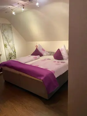 Ein Bett oder Betten in einem Zimmer der Unterkunft Ferienwohnung Rockenbach
