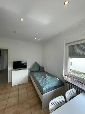Ein Bett oder Betten in einem Zimmer der Unterkunft Renovierte Wohnungen in Koblenz direkt an der Mosel!