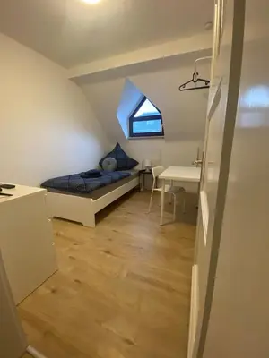 Ein Bett oder Betten in einem Zimmer der Unterkunft Charmante Wohnungen direkt in der Stadtmitte