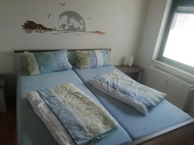 Ein Bett oder Betten in einem Zimmer der Unterkunft Ferienwohnung Moselhöhe