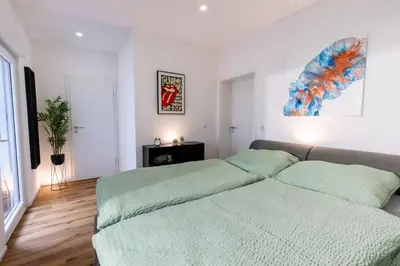 Ein Bett oder Betten in einem Zimmer der Unterkunft Lava-Loft (Ferienwohnung)