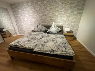 Ein Bett oder Betten in einem Zimmer der Unterkunft NEU! Ferienwohnung Kleine Auszeit