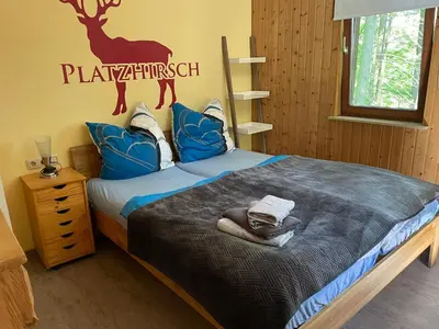 Ein Bett oder Betten in einem Zimmer der Unterkunft Ferienhaus Mellicher Berg