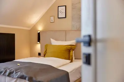 Ein Bett oder Betten in einem Zimmer der Unterkunft Hoffmanns Weinstube