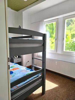 Ein Bett oder Betten in einem Zimmer der Unterkunft Little Rhine View Château - EG Apartment