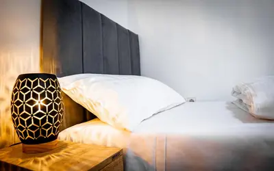Ein Bett oder Betten in einem Zimmer der Unterkunft Rennglück Apartments