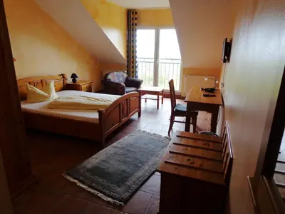 Ein Bett oder Betten in einem Zimmer der Unterkunft Hotel Leo's Ruh