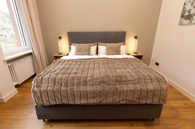 Ein Bett oder Betten in einem Zimmer der Unterkunft Kontor 22 - Luxus Ferienwohnung mit Sauna und Garten