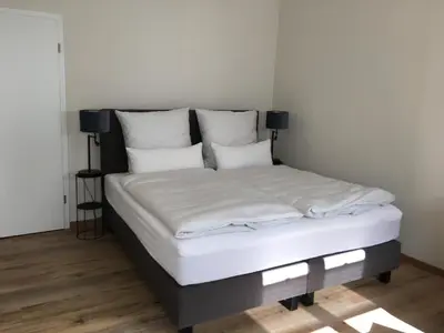 Ein Bett oder Betten in einem Zimmer der Unterkunft Ferienwohnung Heuser II