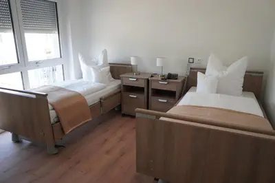 Ein Bett oder Betten in einem Zimmer der Unterkunft ISA Rheinquartier - Moderne und barrierefreie Ferienapartments