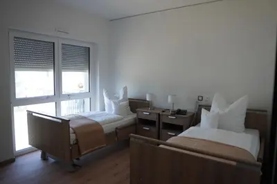 Ein Bett oder Betten in einem Zimmer der Unterkunft ISA Rheinquartier - Moderne und barrierefreie Ferienapartments