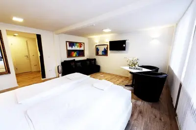 Ein Bett oder Betten in einem Zimmer der Unterkunft MoselUnion - Haus Burg Chaussee