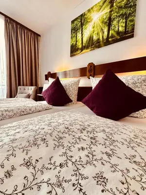 Ein Bett oder Betten in einem Zimmer der Unterkunft HAUS BENICO -Pension-