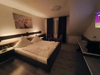 Ein Bett oder Betten in einem Zimmer der Unterkunft HAUS BENICO -Pension-