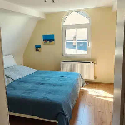 Ein Bett oder Betten in einem Zimmer der Unterkunft Castello Apartment Boppard