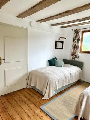 Ein Bett oder Betten in einem Zimmer der Unterkunft Kutscherhaus der Burg Oberehe